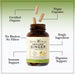 Bottle of Herbal Roots Organic Ginger with three pills spilling out of the top of the bottle. There are several lines pointing to the bottle and the capsules. The lines say Certified Organic, Vegan Capsules, Single ingredient, No Binders or fillers, Immune support and digestive support.